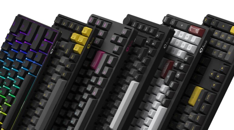 Collection of colorful mechanical keyboards with RGB lighting showcasing different layouts and custom keycap designs.
